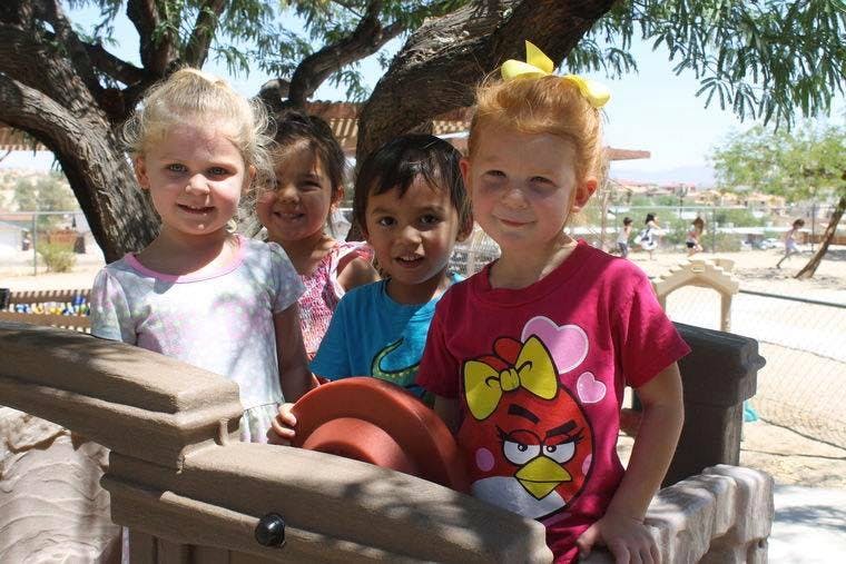 Four children standing outdoors