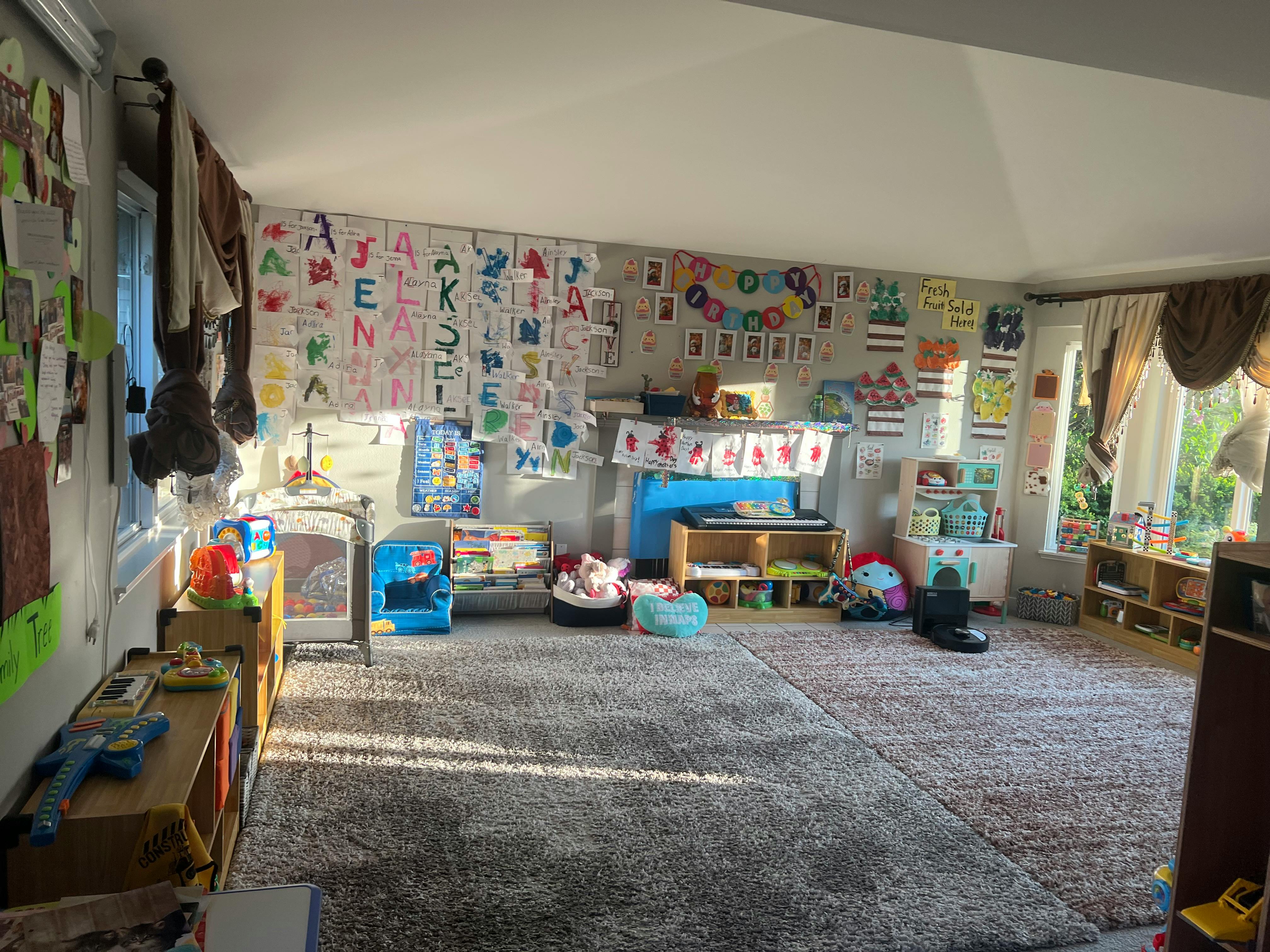 Classroom with alphabet charts and children's artwork on walls