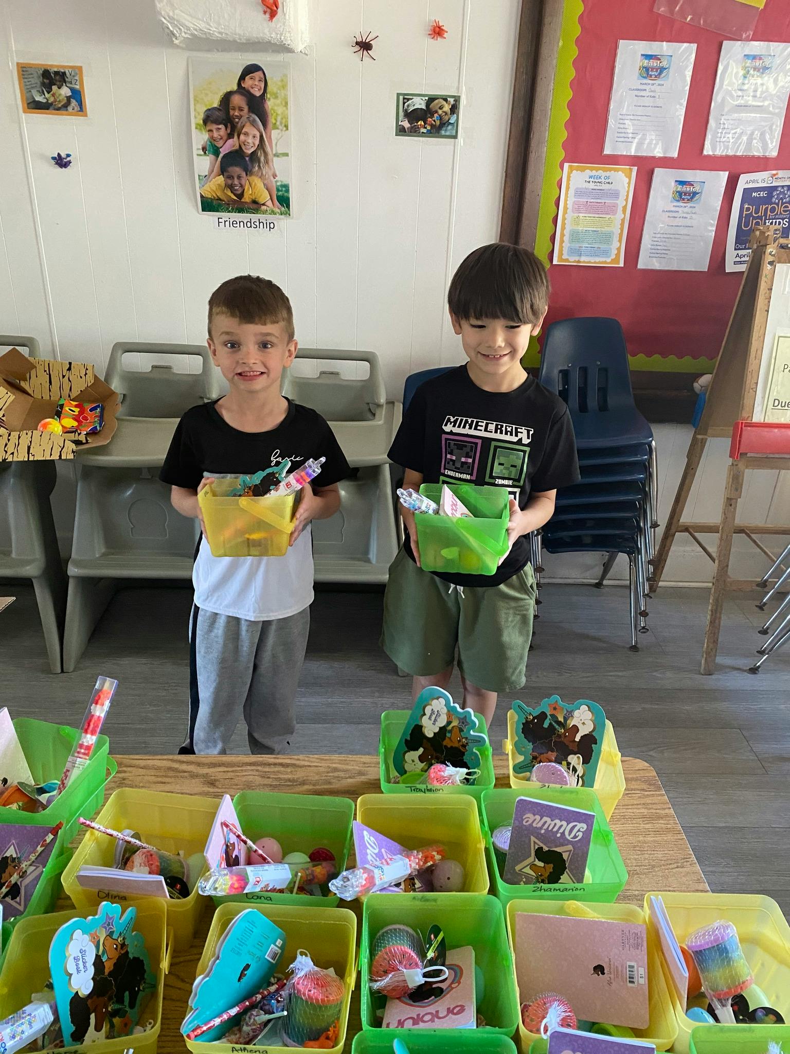 Two children holding baskets filled with items in a classroom setting