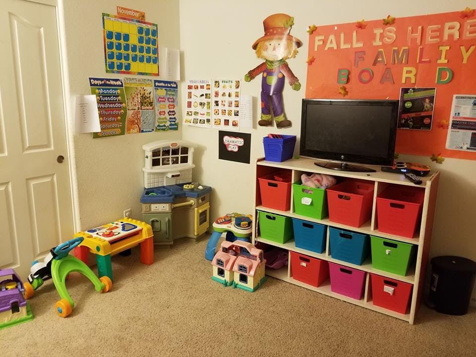 Playroom with toys, storage bins, and a television