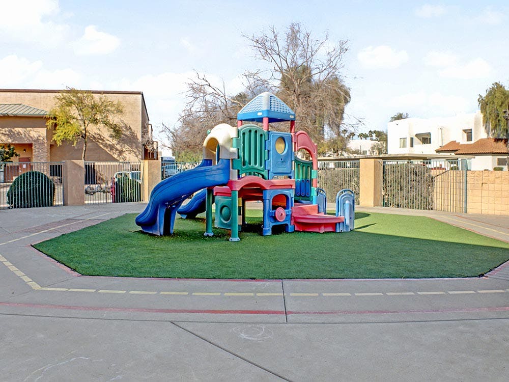 Colorful playground structure on artificial turf