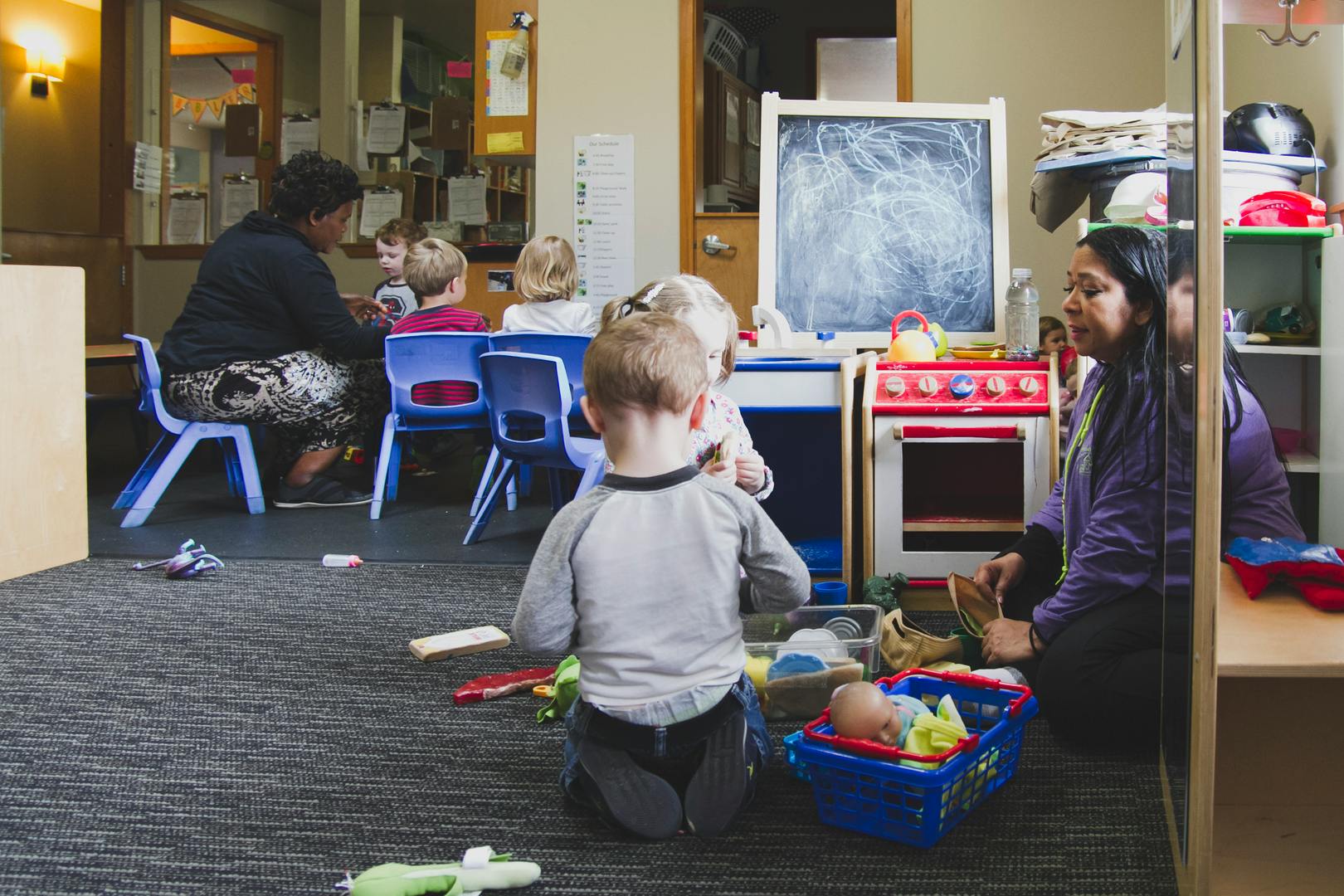 Adults and children in a classroom