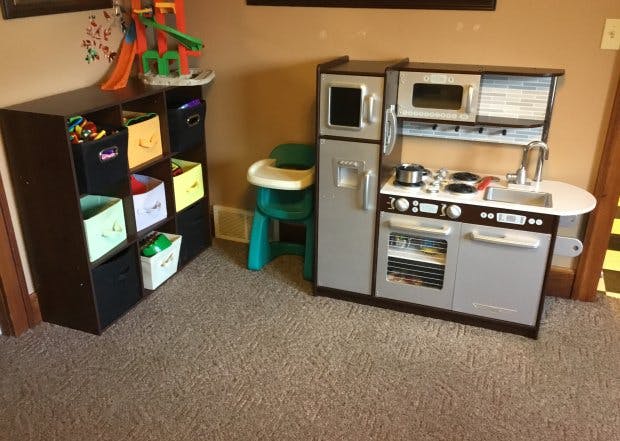 Toy kitchen and storage shelf with bins