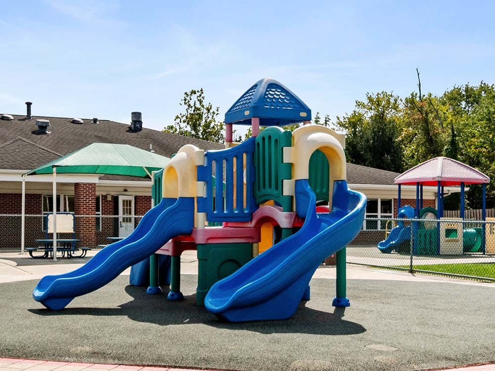 Colorful playground with slides and climbing structures