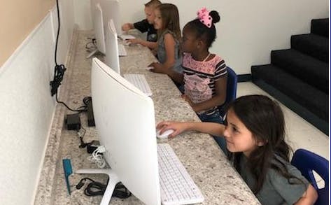 Children using computers in a classroom