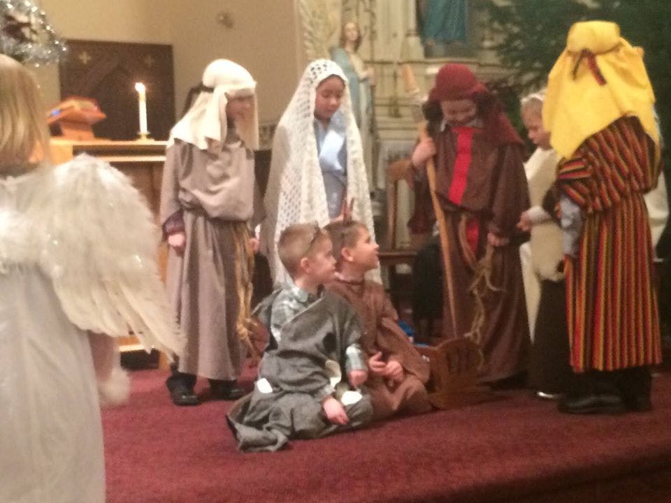 Children in costumes performing a play