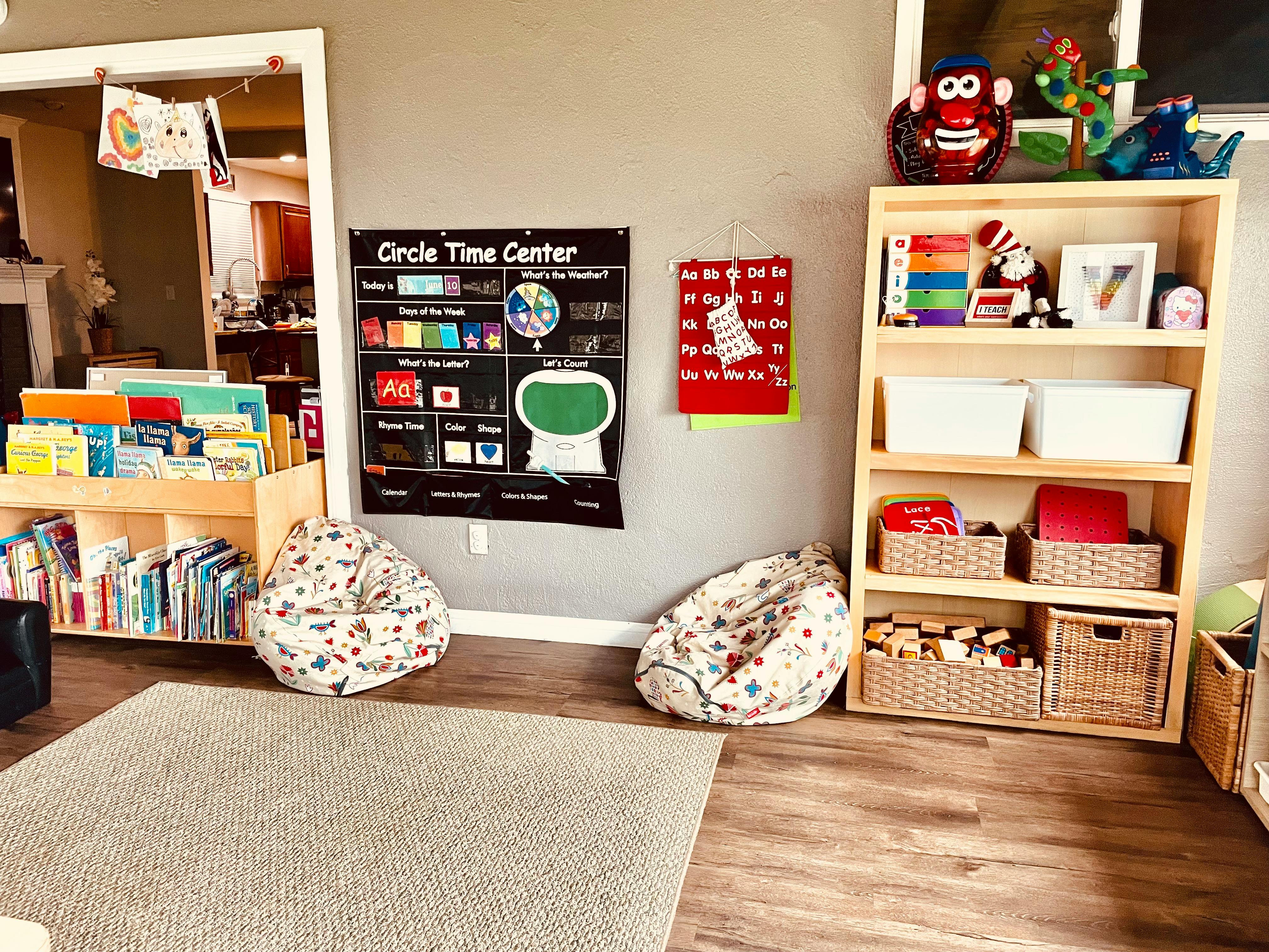 Classroom with a bookshelf, beanbag chairs, and a "Circle Time Center" chart