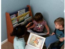 Three children reading books