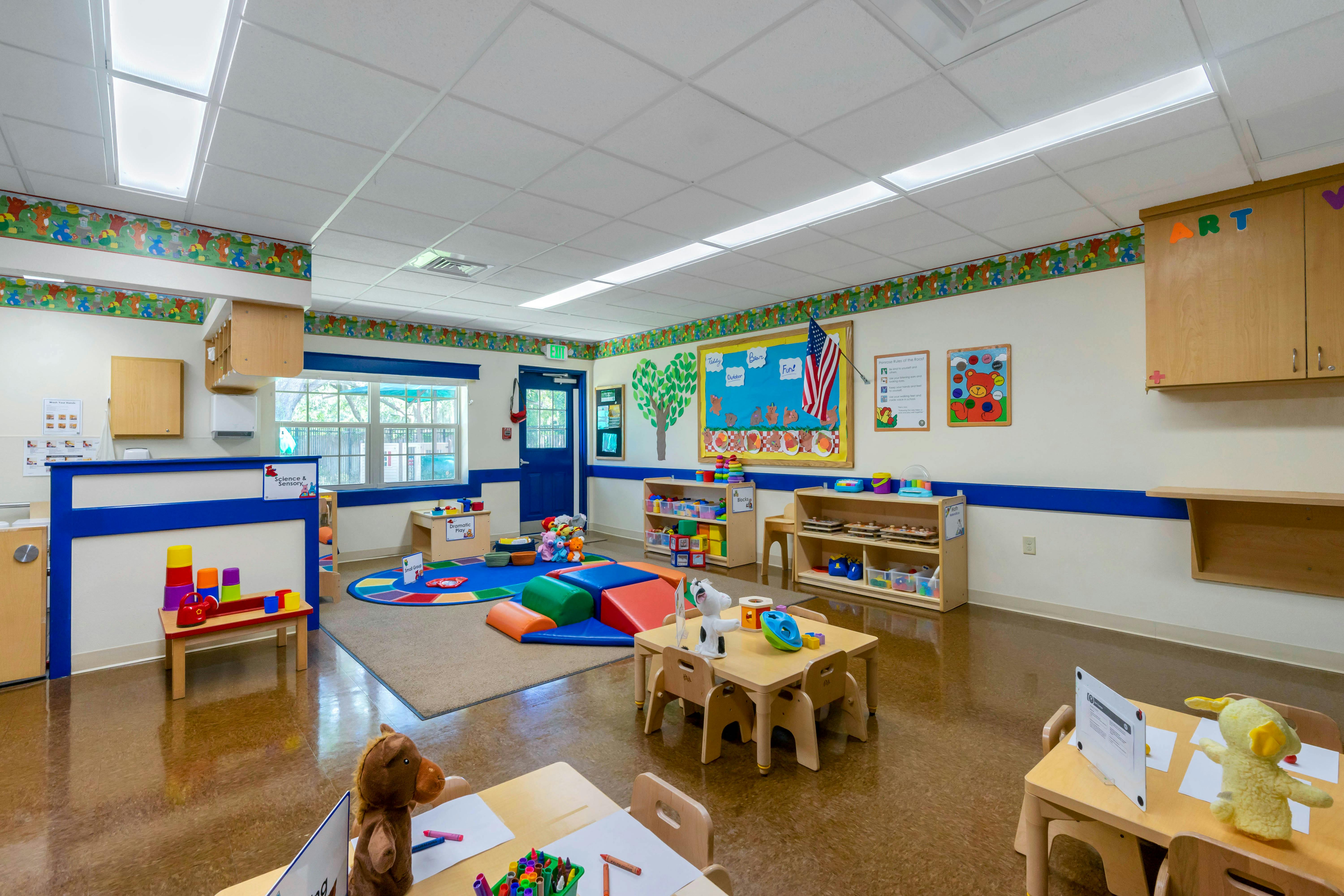 Colorful and organized early learning classroom with activity stations