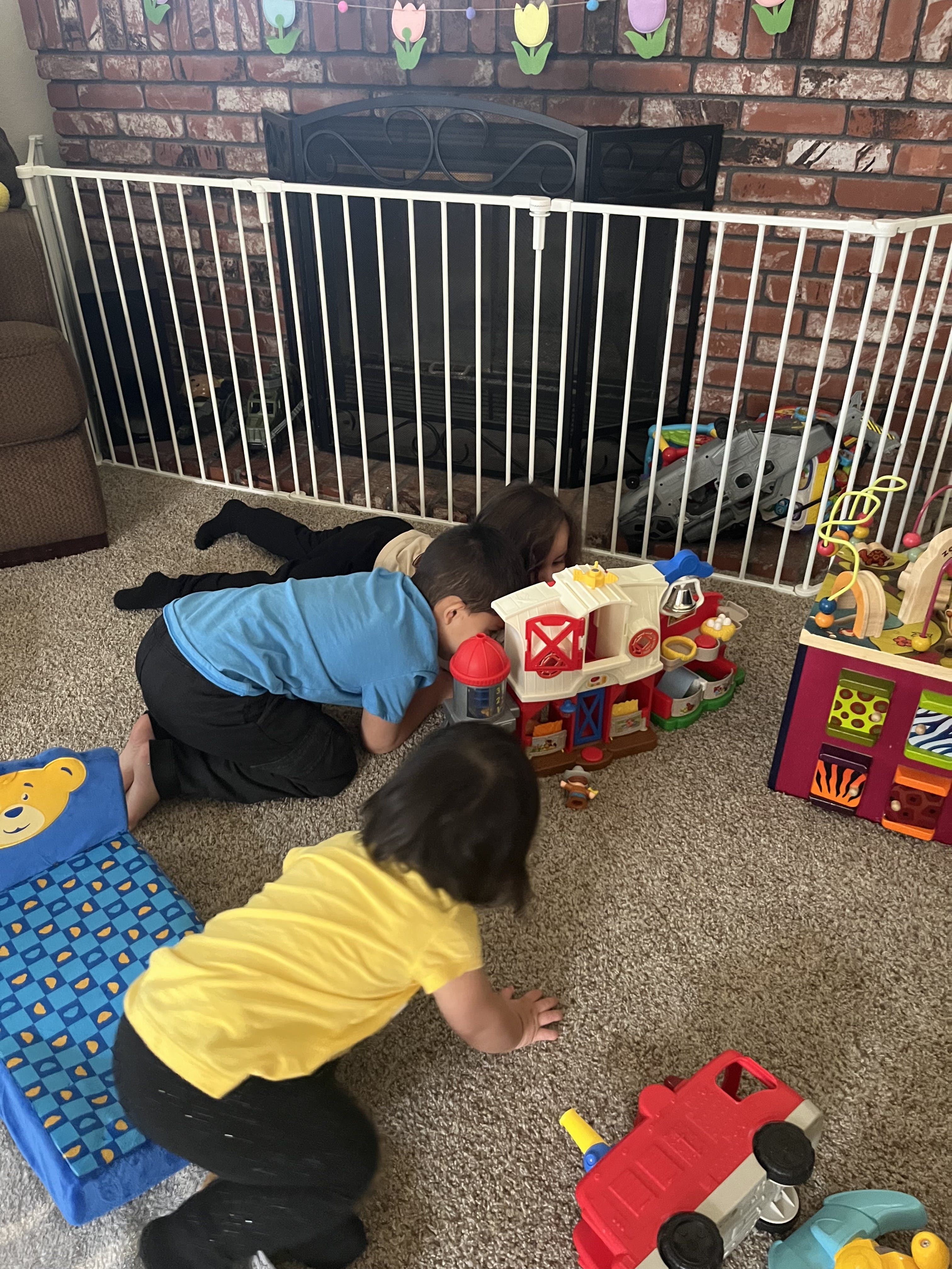 Children playing with toys on a carpeted floor
