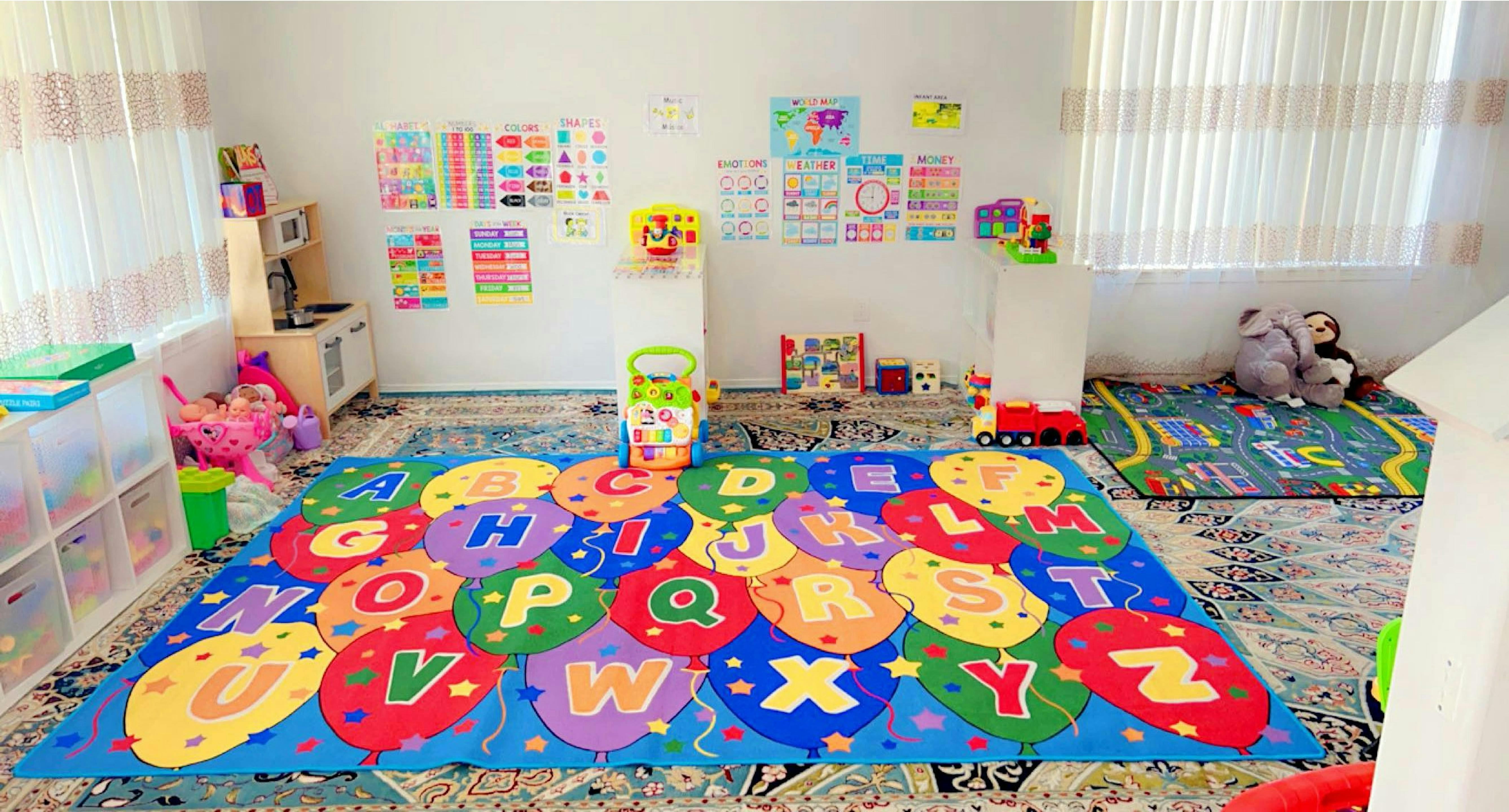Playroom with alphabet rug and colorful wall decorations