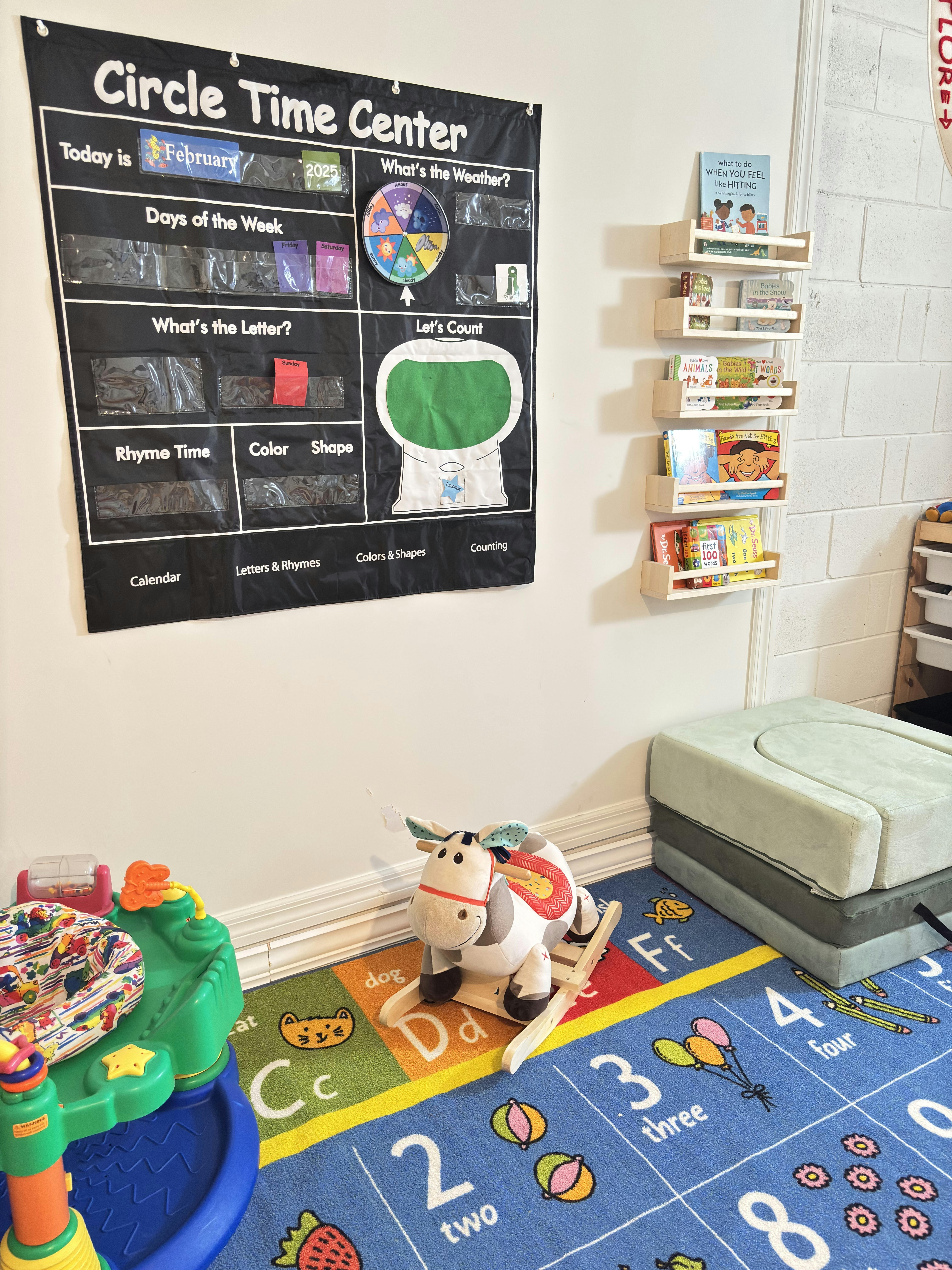 Circle Time Center chart on a wall above a colorful rug with toys