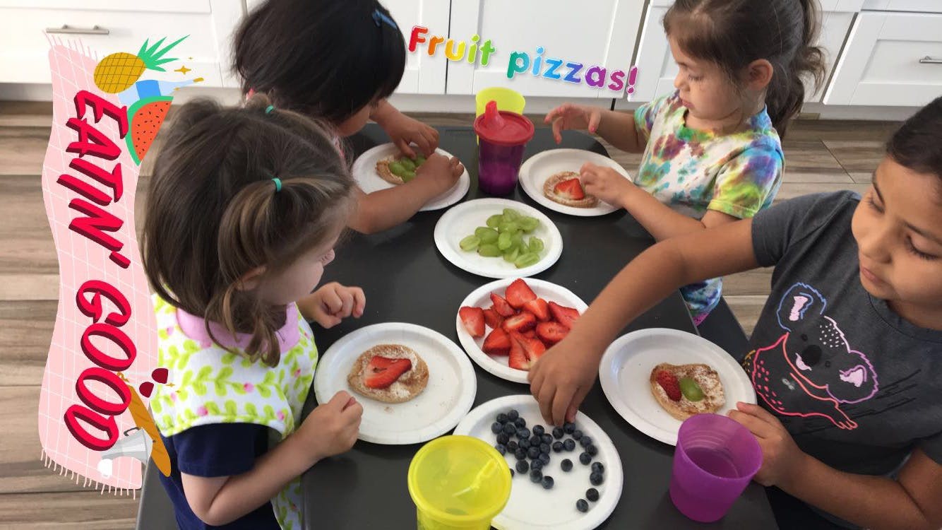 Children making fruit pizzas