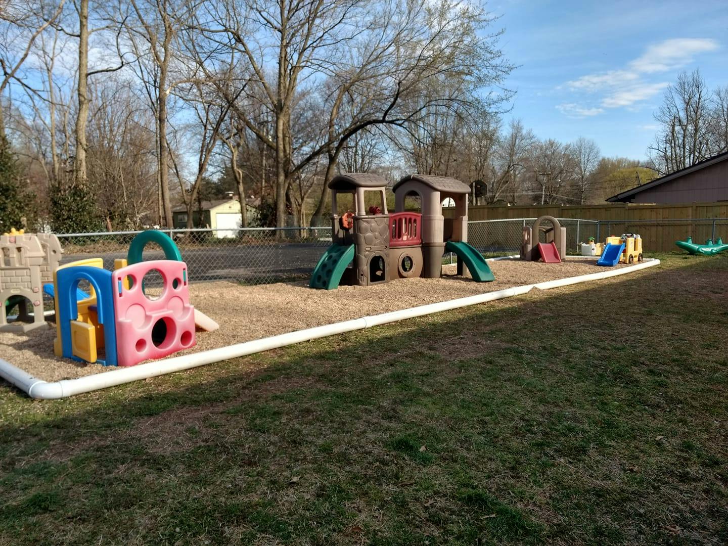 Outdoor playground with various play structures and slides