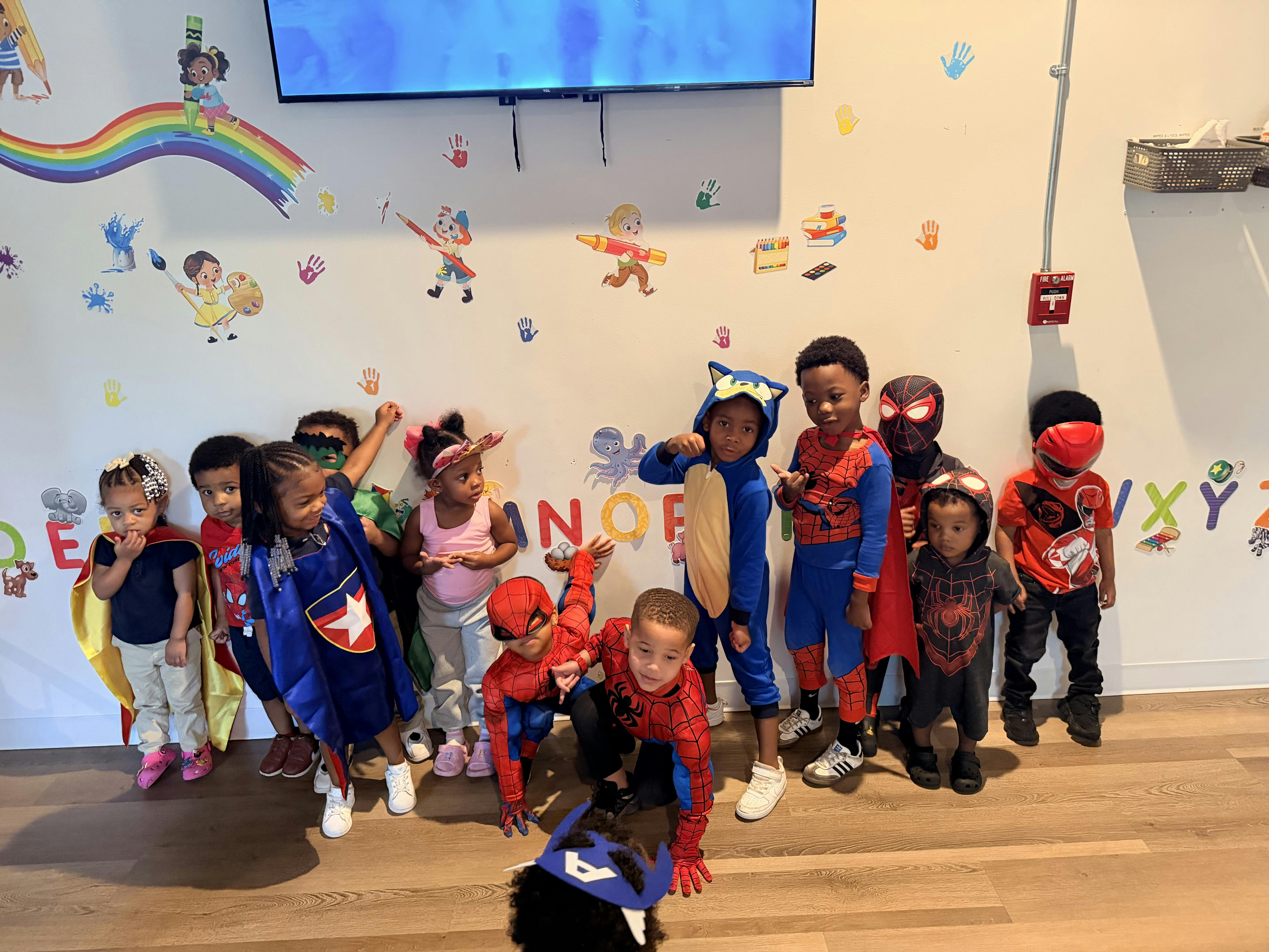 Group of children wearing costumes in a classroom