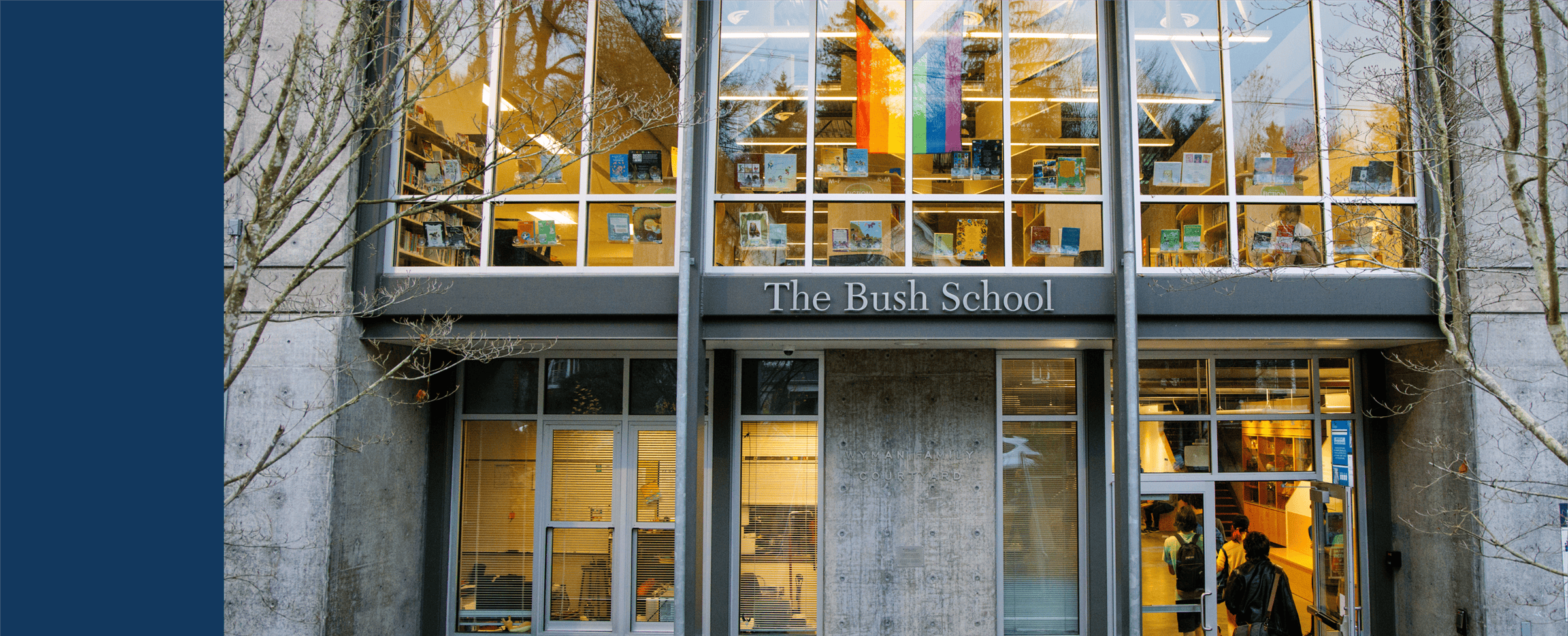 Entrance to The Bush School, with students entering and books displayed in windows