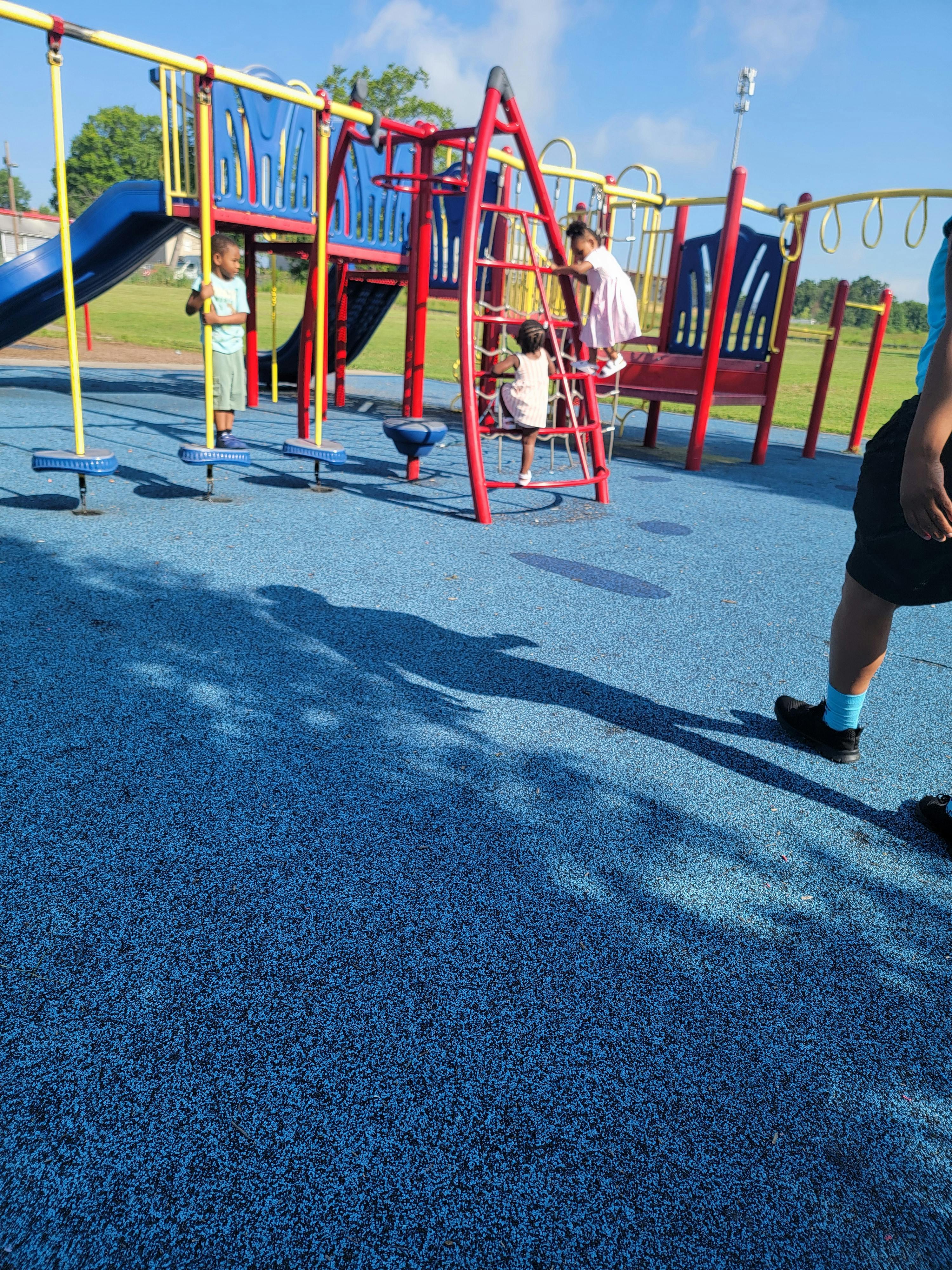 Children playing on a playground structure