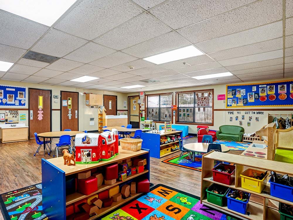 A colorful and tidy classroom with various learning and play areas