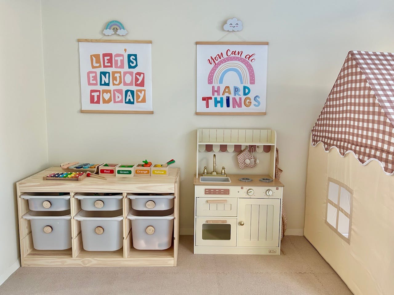 Playroom with toy kitchen, storage unit, and play tent