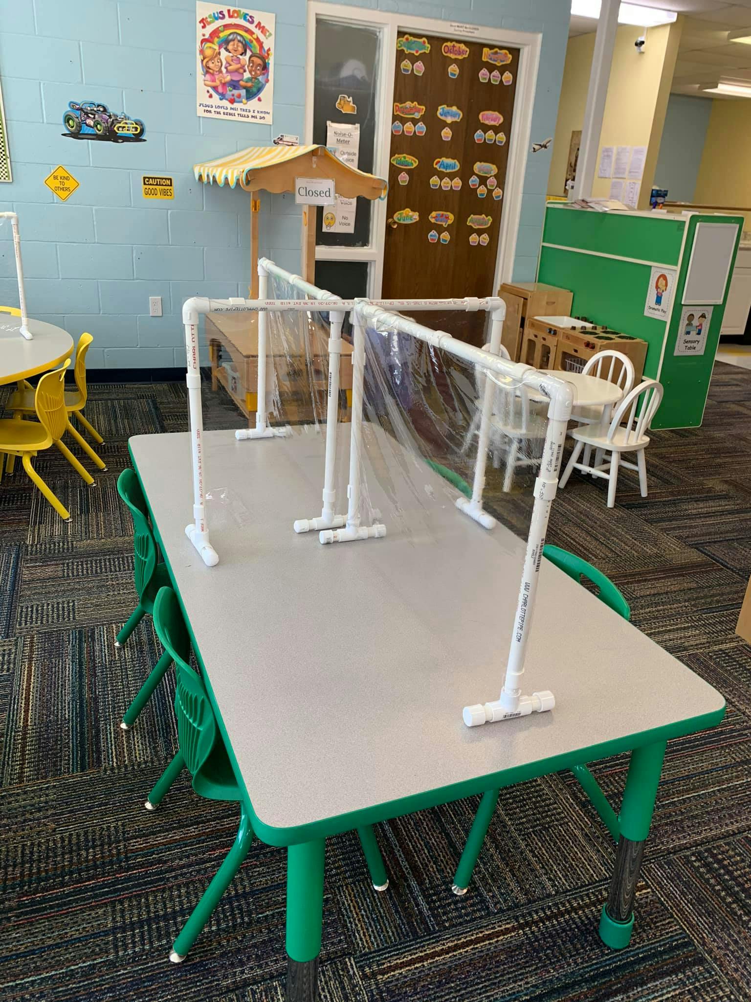 Classroom table with clear plastic dividers