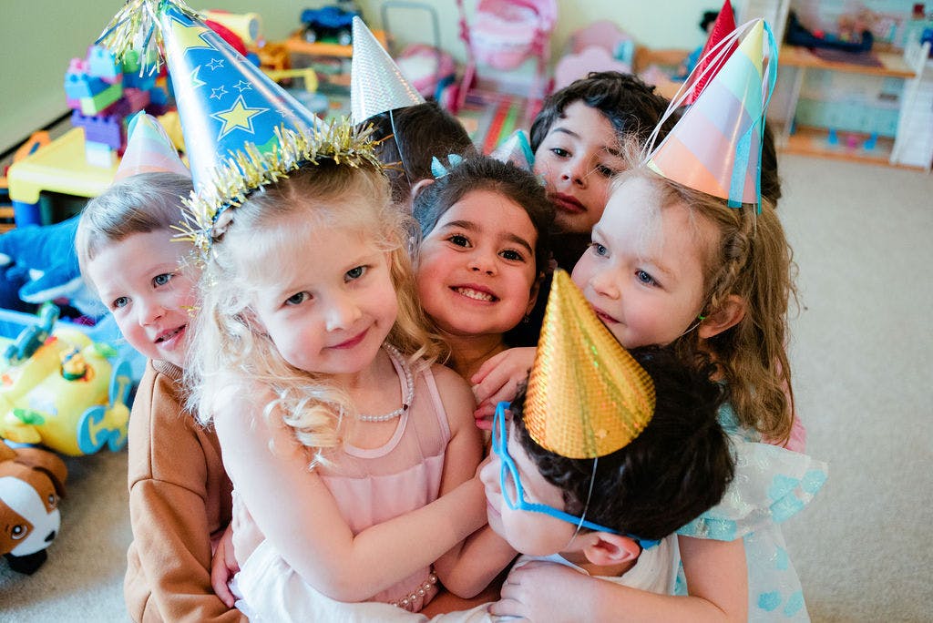 Group of children wearing party hats