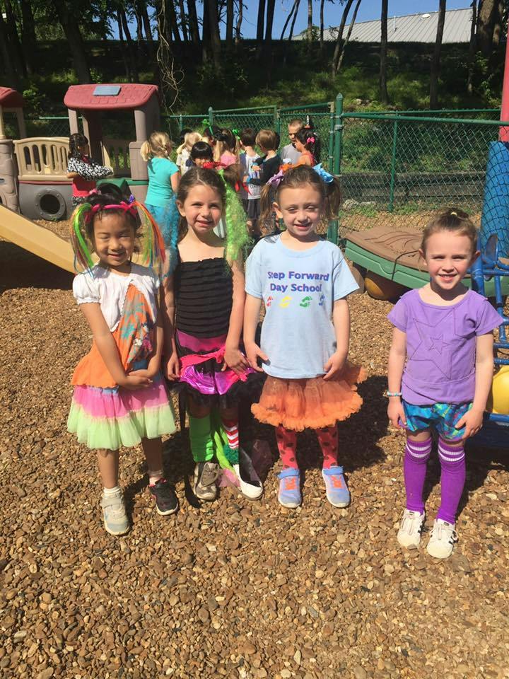 Four children standing on a playground