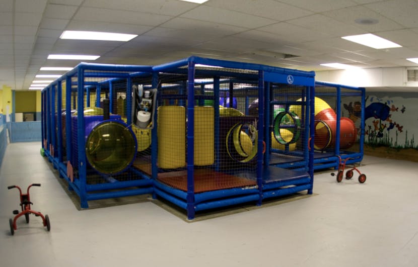 Indoor playground structure with tunnels and climbing areas