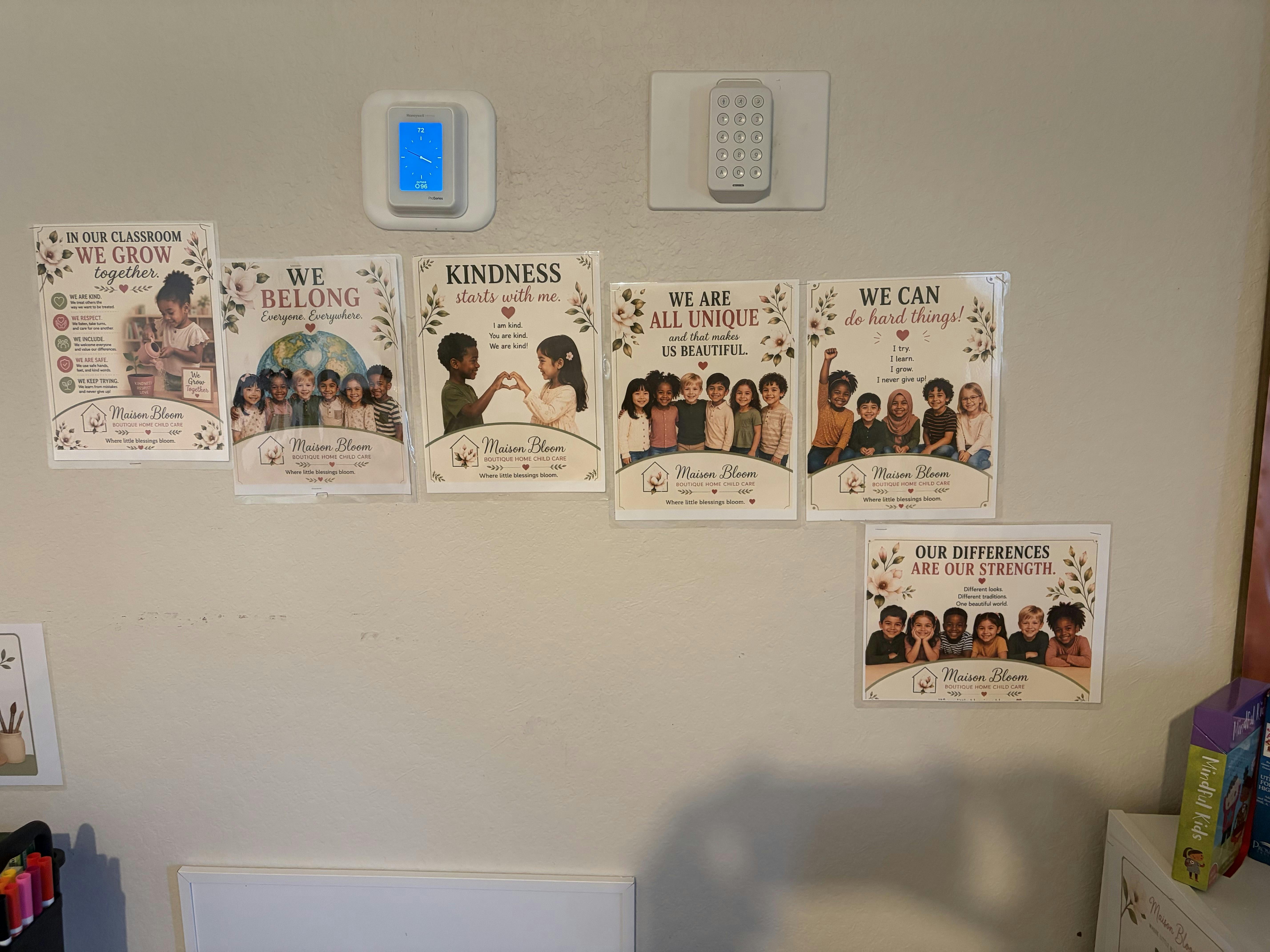 Educational posters with inclusive messaging displayed on a wall