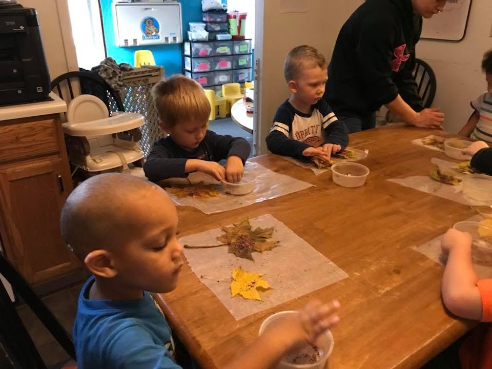 Children doing crafts at a table