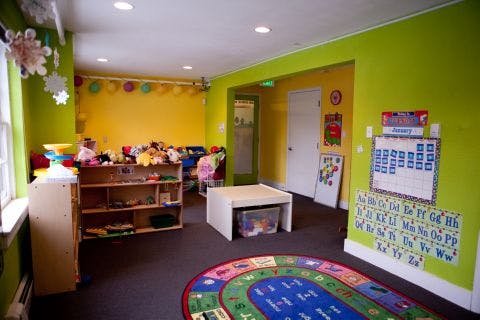 Playroom with colorful walls, toys, and an alphabet chart