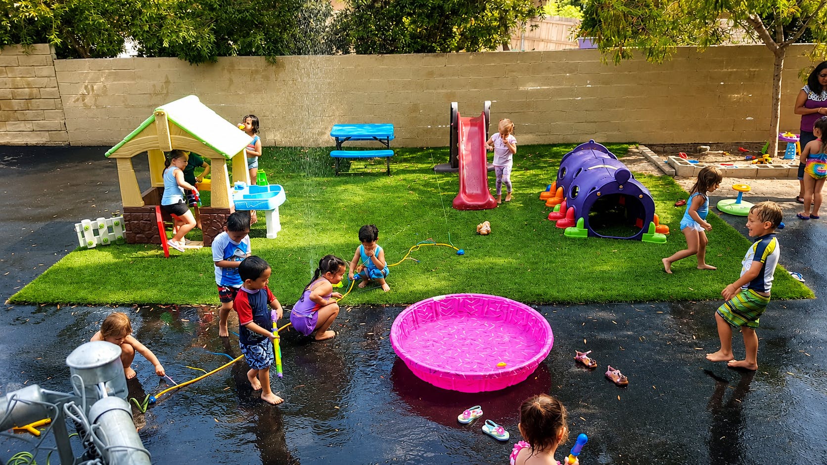 Children playing with water and toys in a backyard