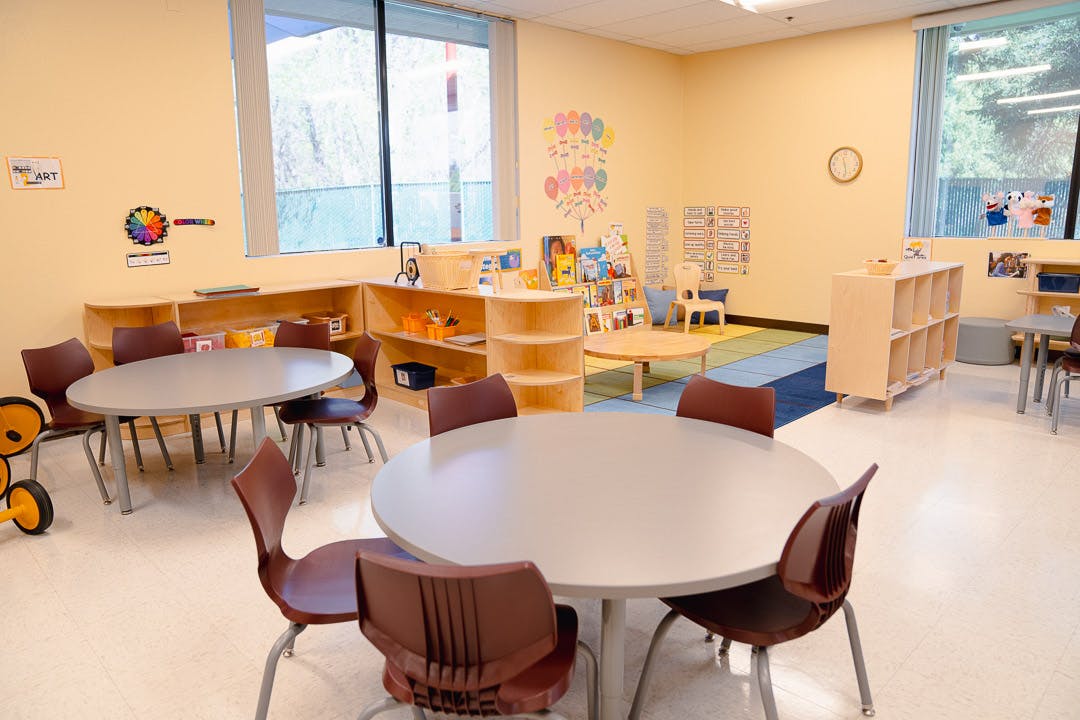 Empty classroom with tables and chairs