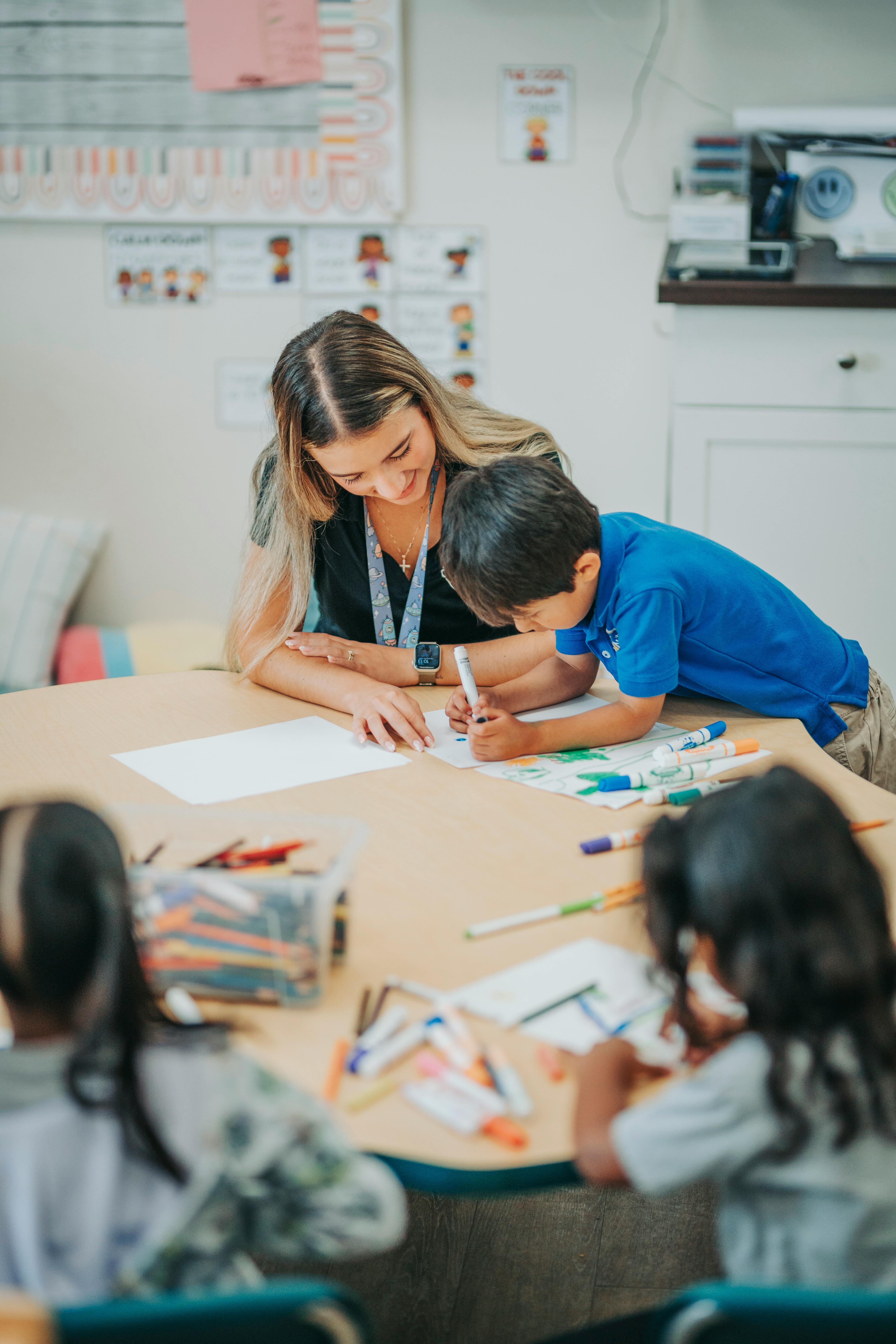 Adult and child drawing together at a table