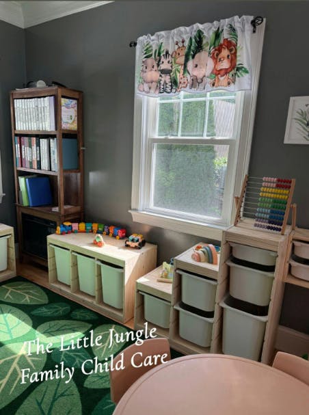 Child care room with window, bookshelf, and toy storage