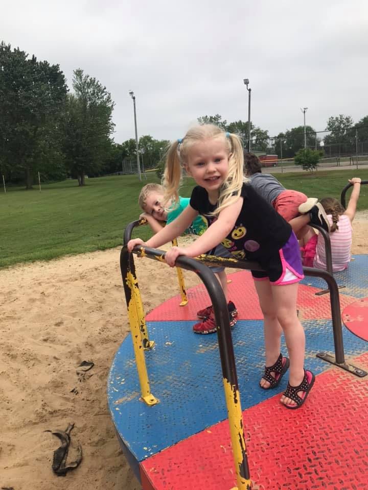 Children on a merry-go-round at a playground