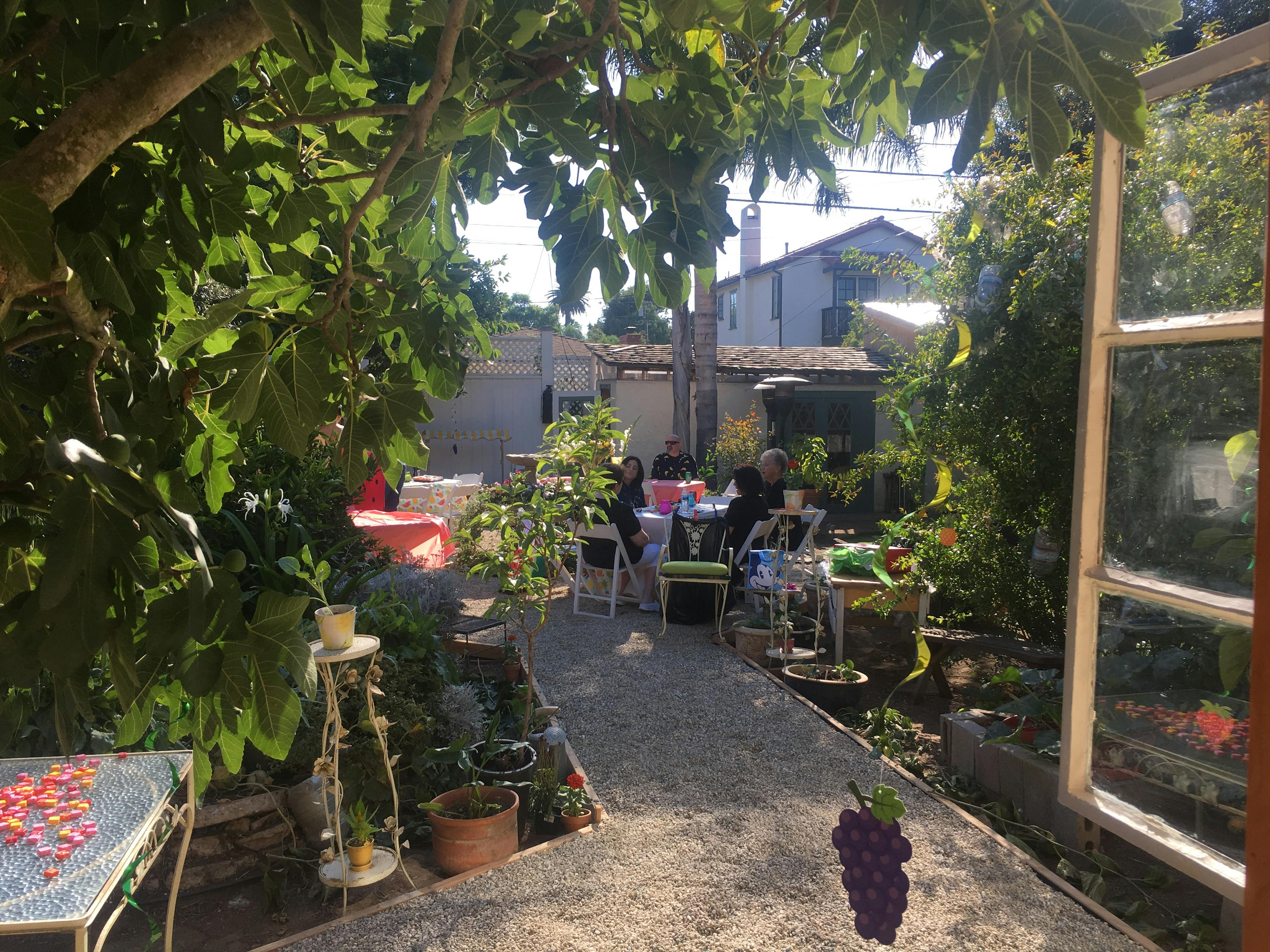 People sitting at a table in a garden