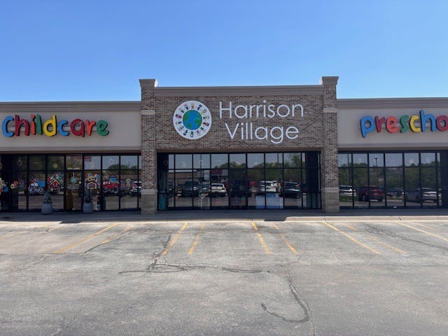 Harrison Village storefront with Childcare and Preschool signs