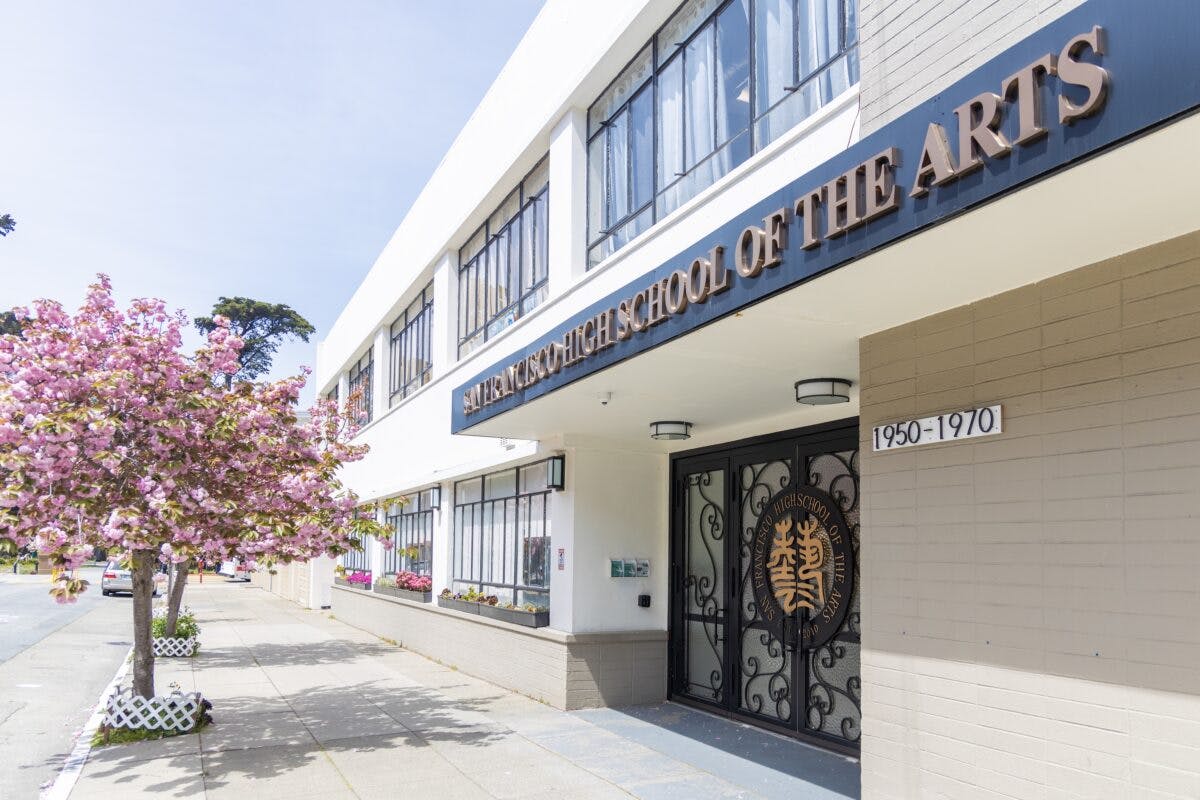 San Francisco High School of the Arts building entrance with a flowering tree