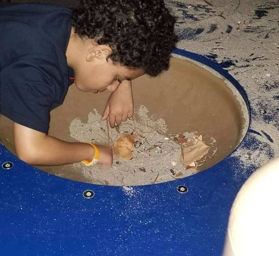 Child playing in a sand pit