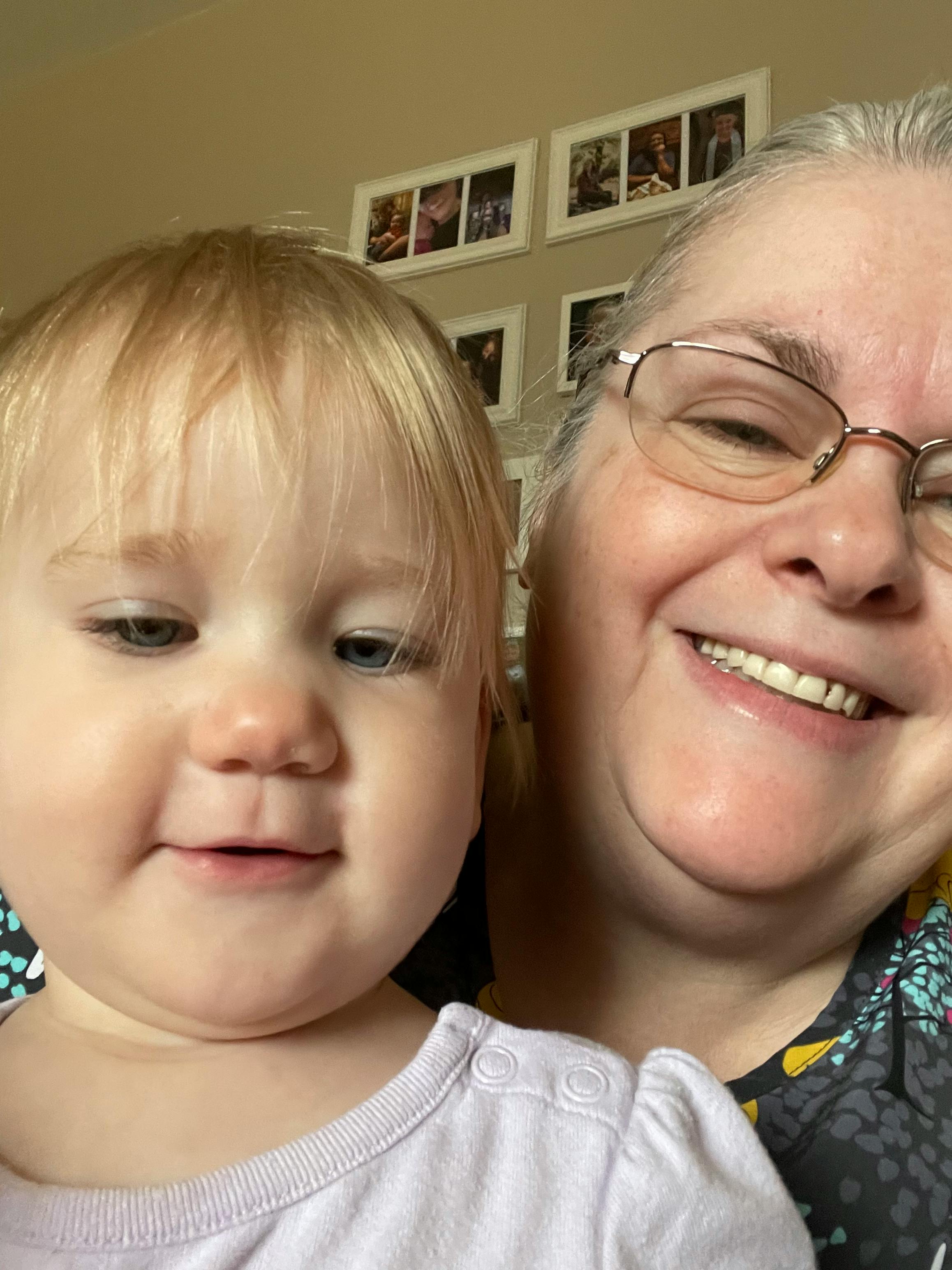 Adult and child smiling at close range