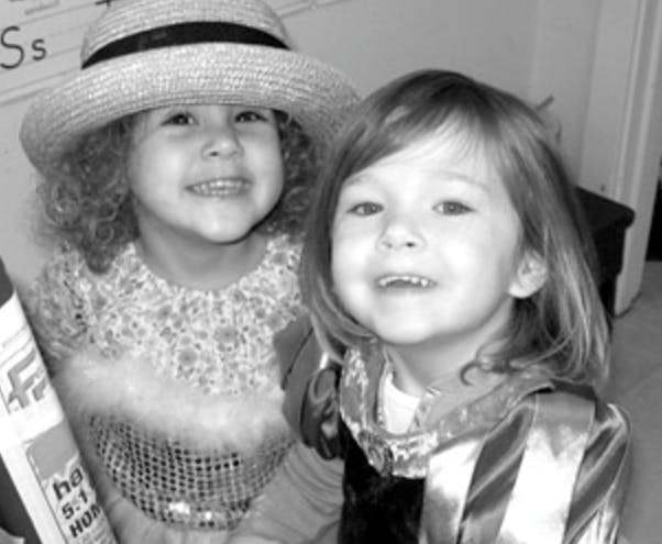 Two children smiling at the camera