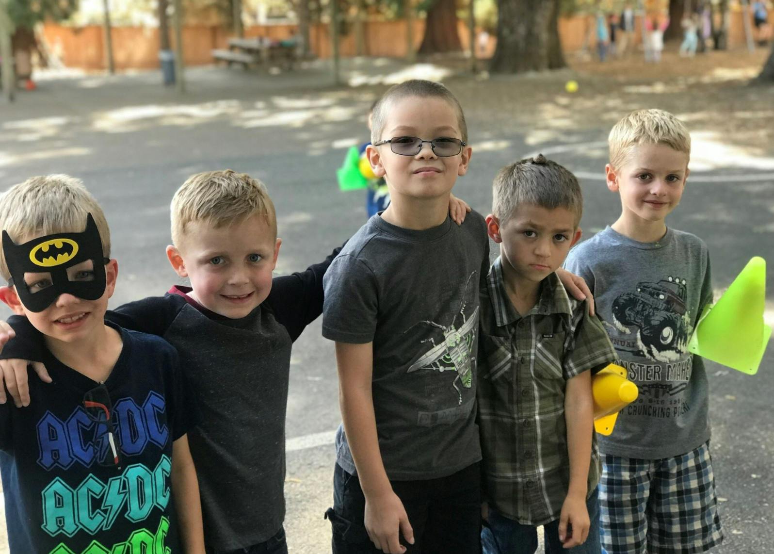 Five children standing together outdoors