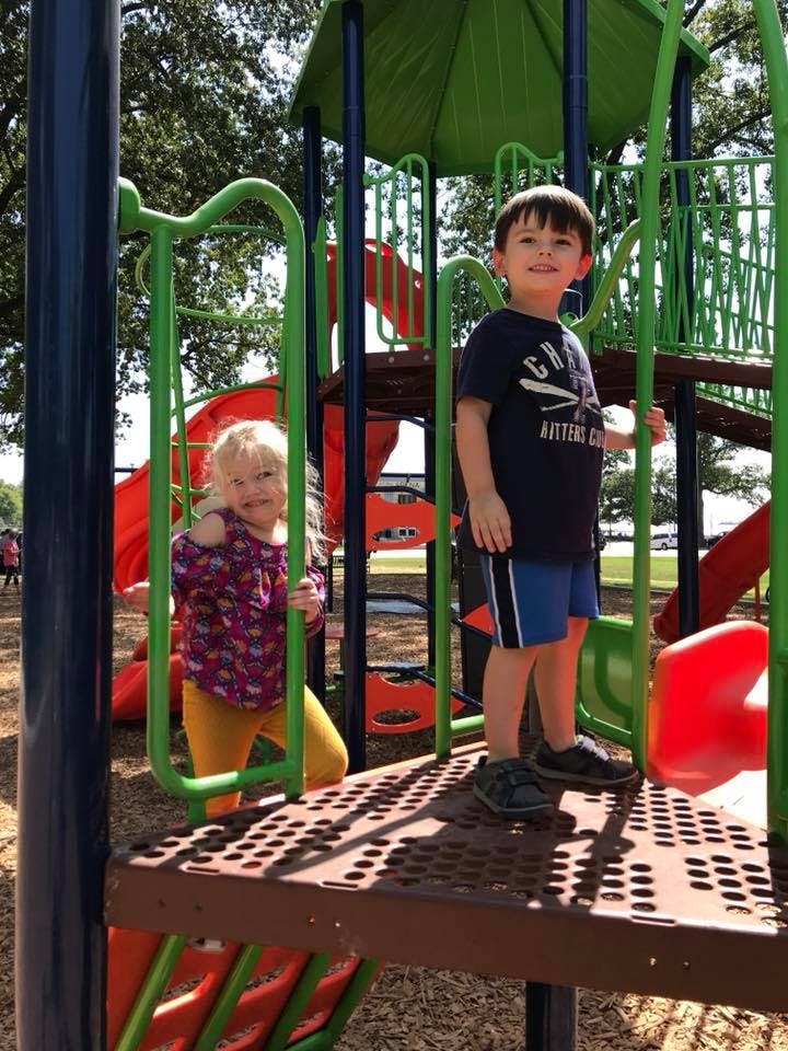 Two children on a playground structure