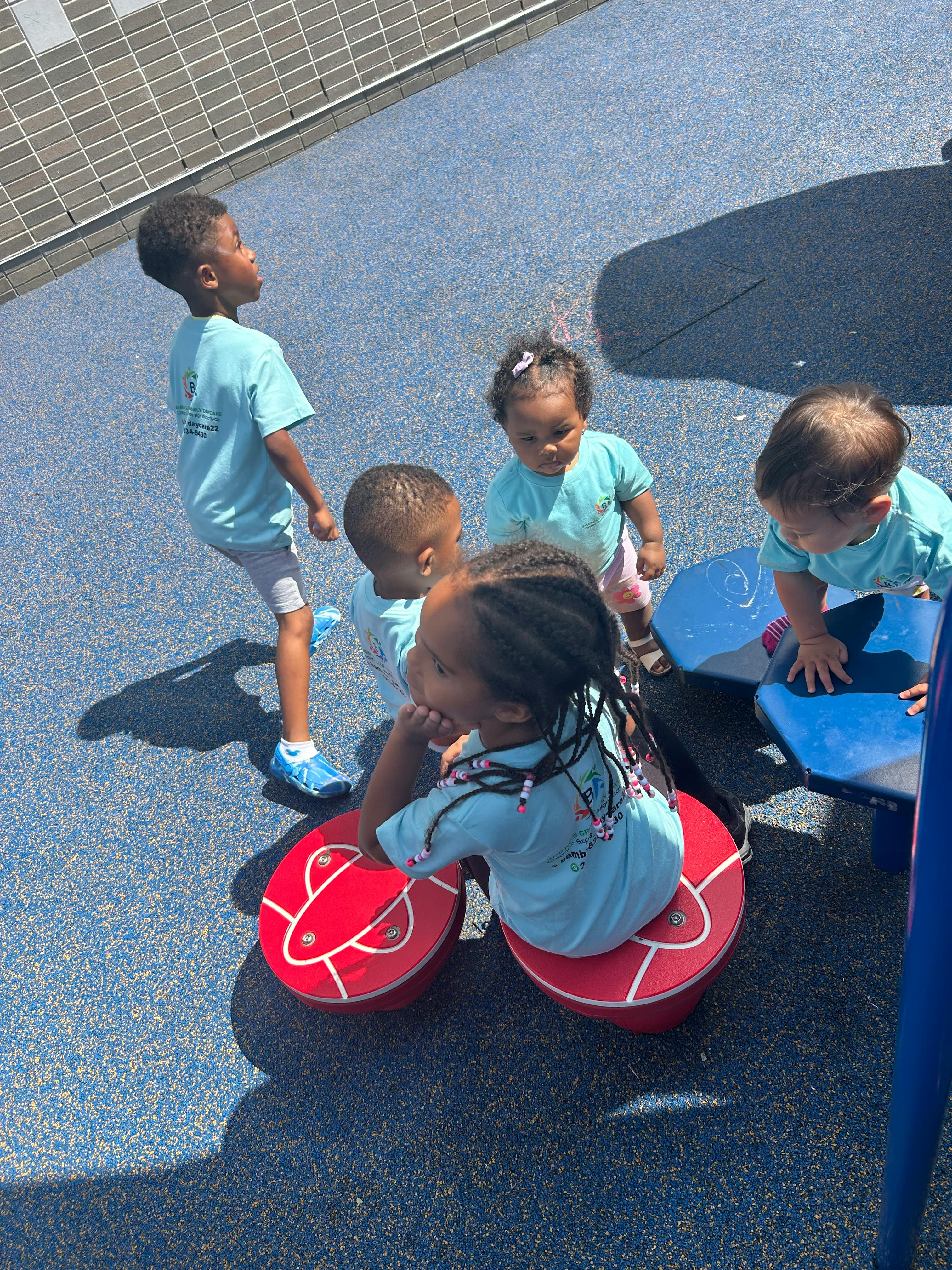 Children playing on outdoor equipment