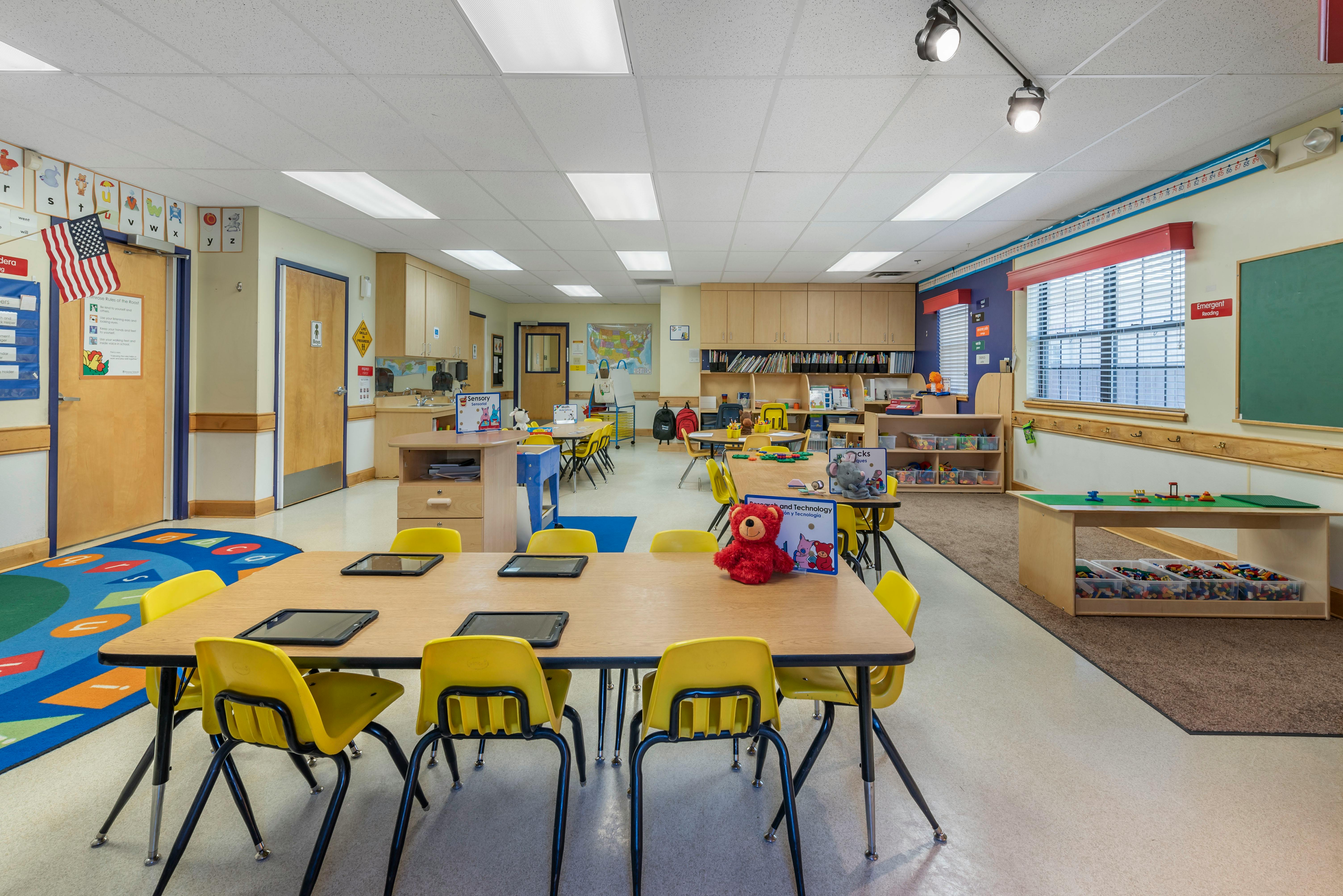 Classroom with tables, chairs, and learning materials