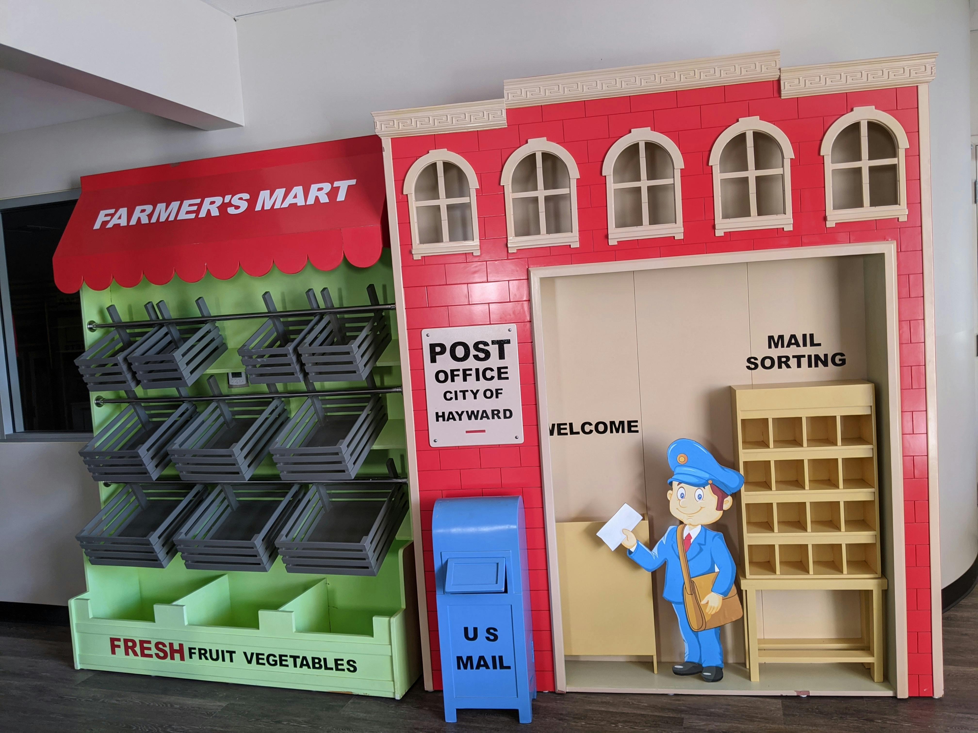 Play farmer's market stand and post office with a mail carrier cutout