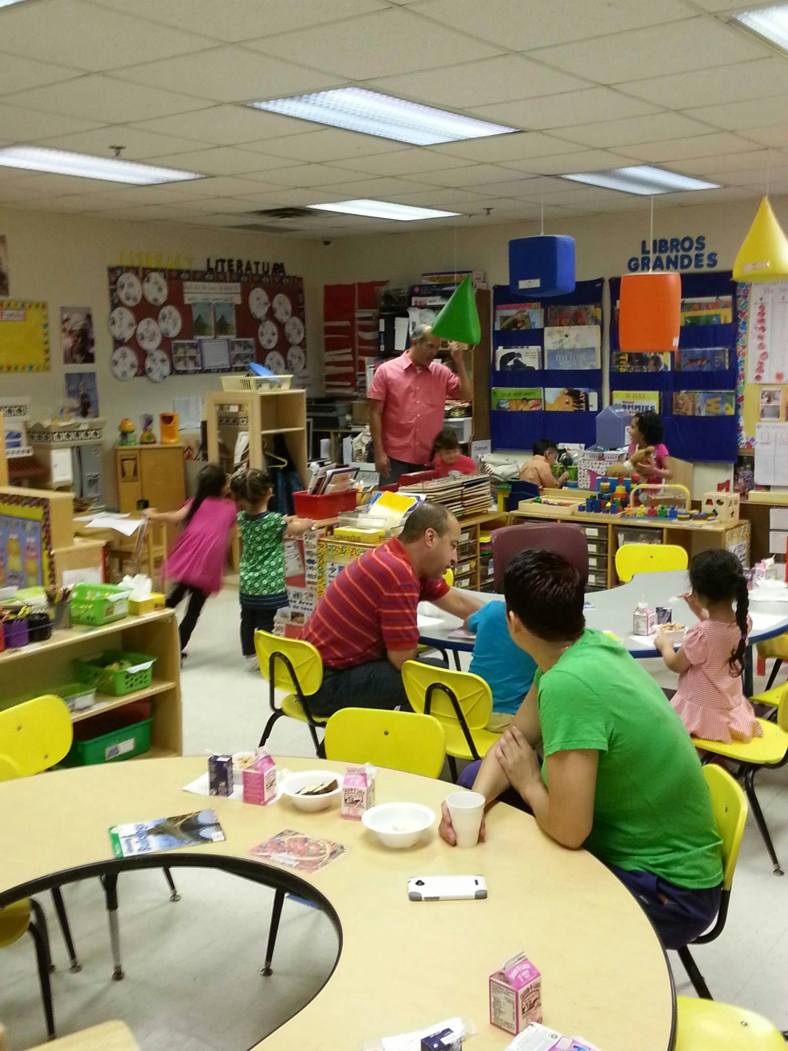 People and children in a classroom