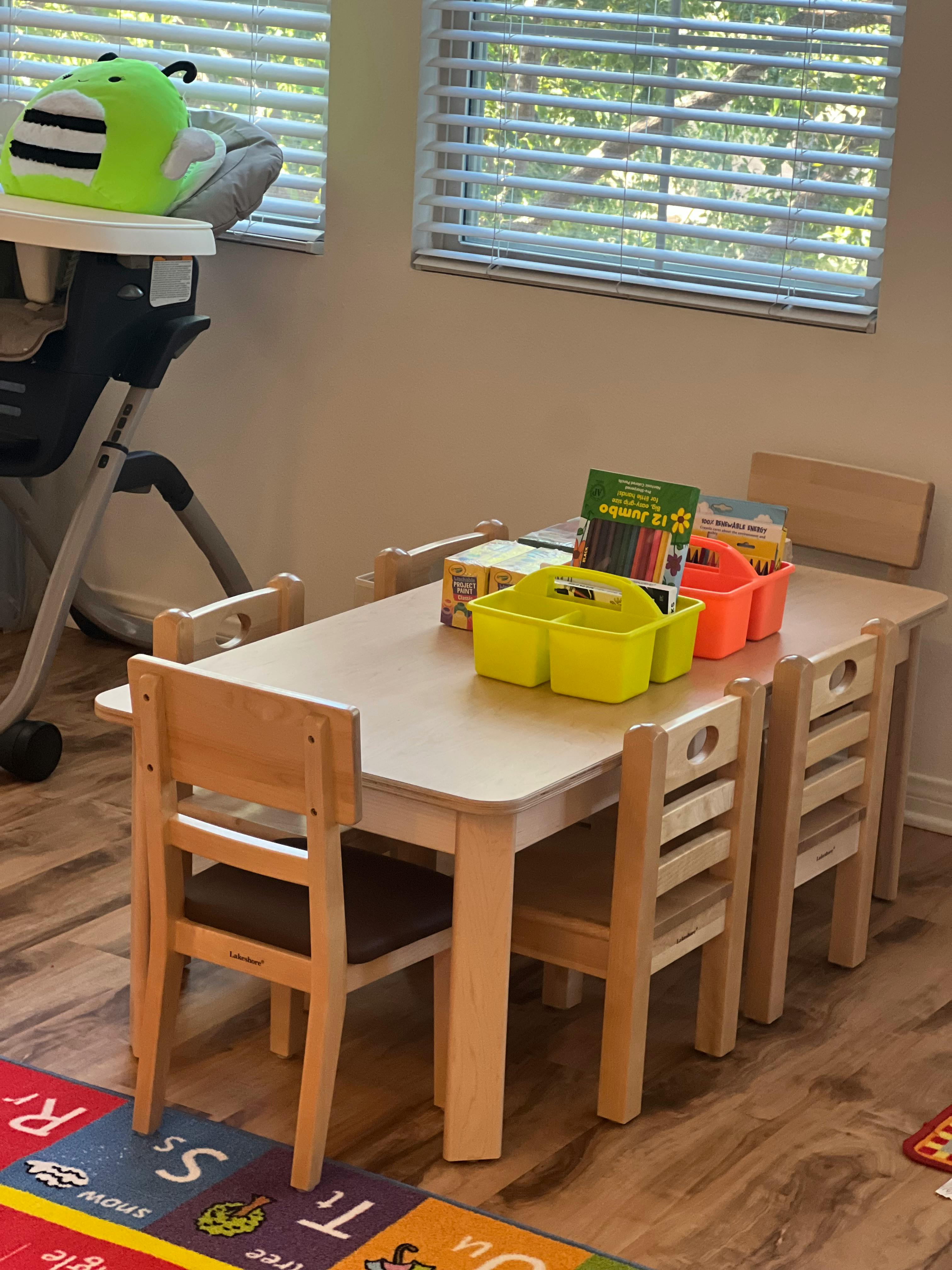 Children's table and chairs with art supplies