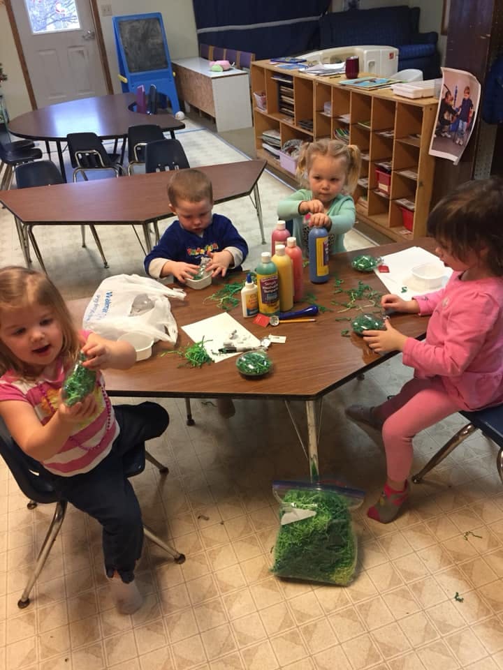 Children doing crafts at a table