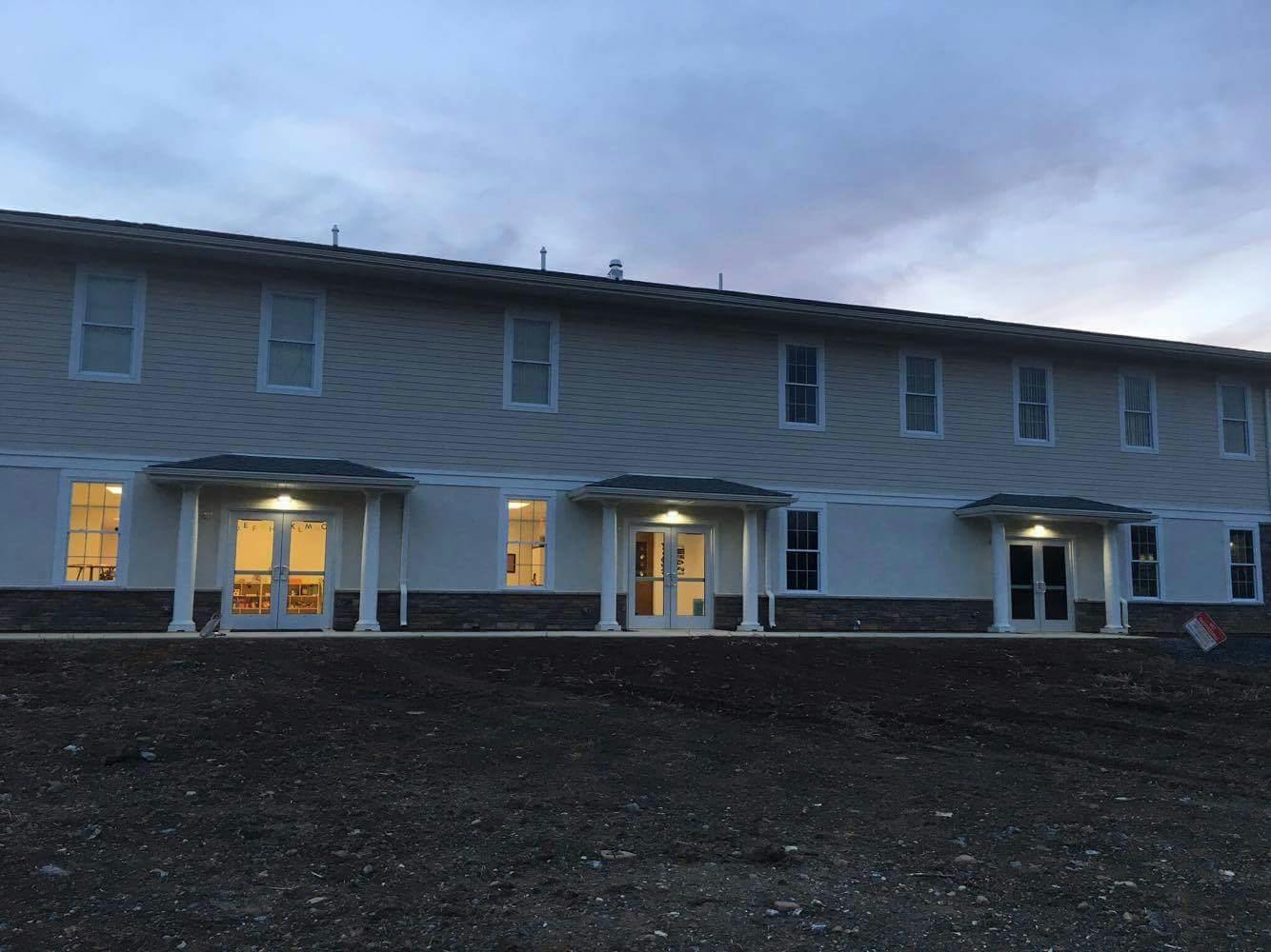 Exterior of a building with multiple windows and doors